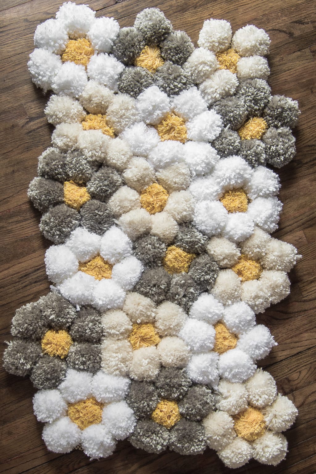 handmade yarn pom pom rug