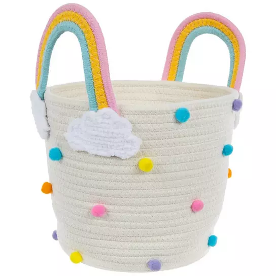 woven basket with pom poms