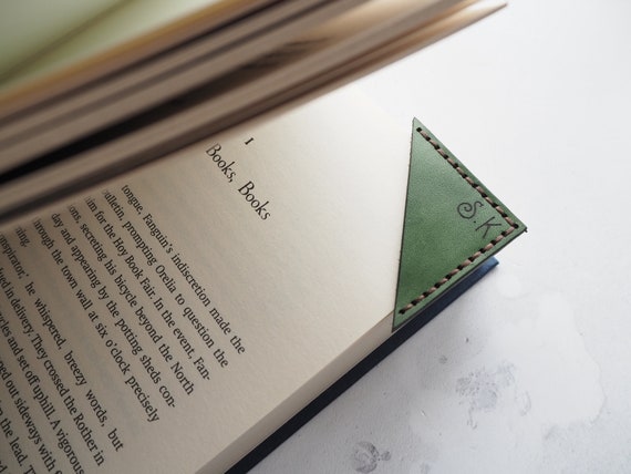 leather corner bookmark stitched on book page