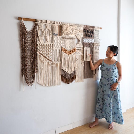 large macrame wall hanging above sofa