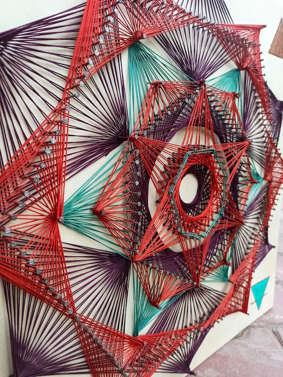 string art geometric on wood board