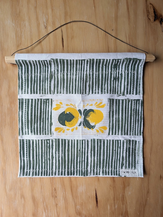 fabric wall hanging with wood dowel
