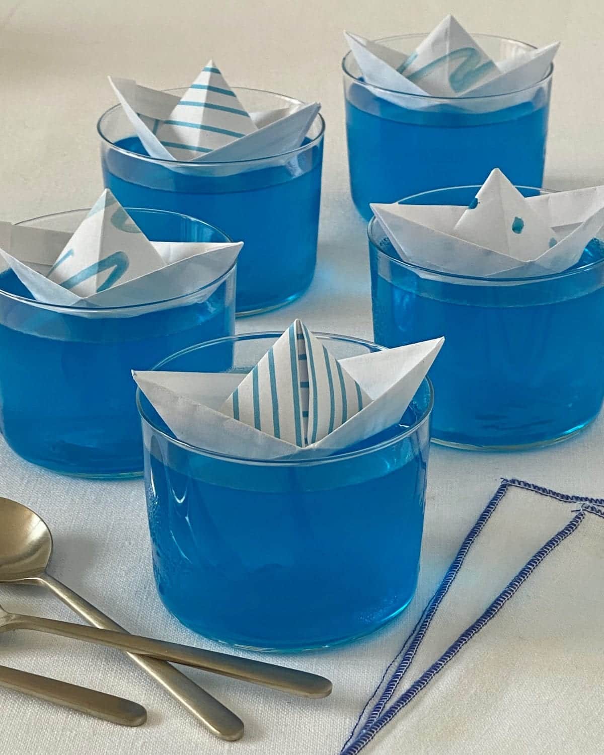 folded paper boats floating in bowl
