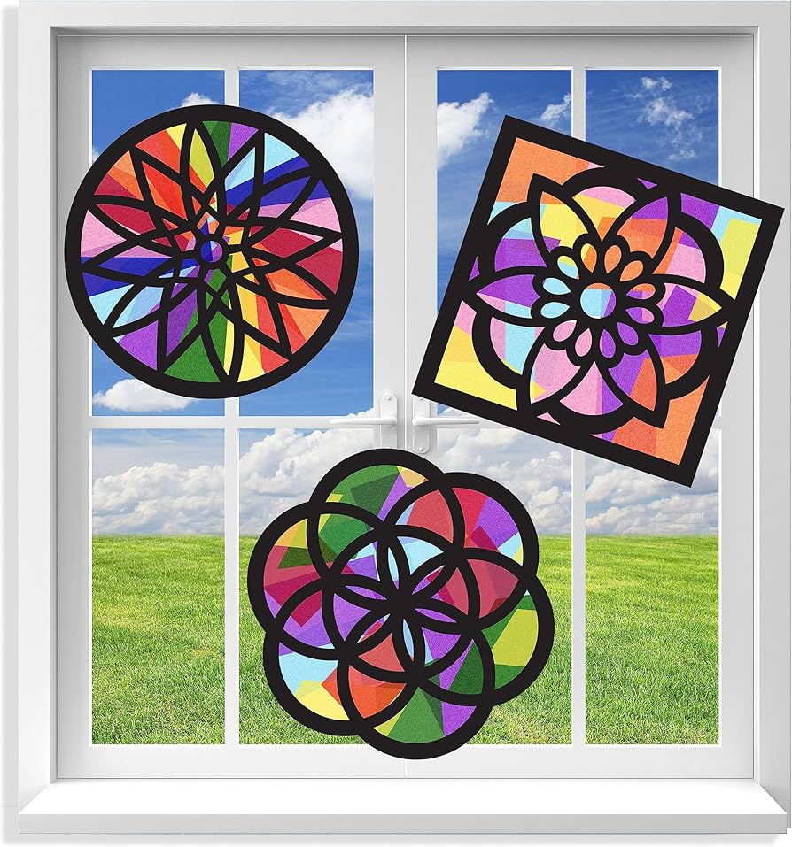 paper cutout window hangings with sunlight