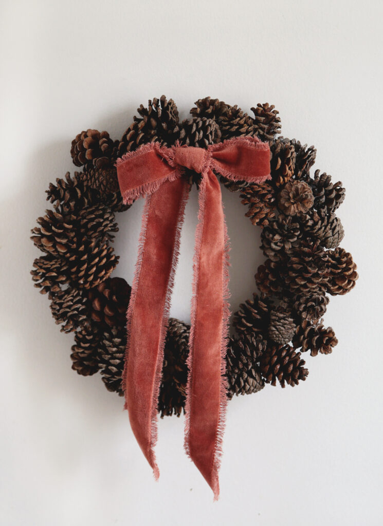 pinecone wreath with ribbon