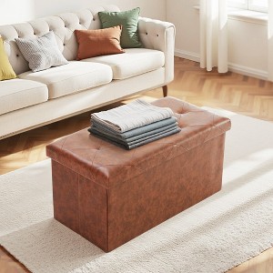 leather ottoman with folded throw in living room