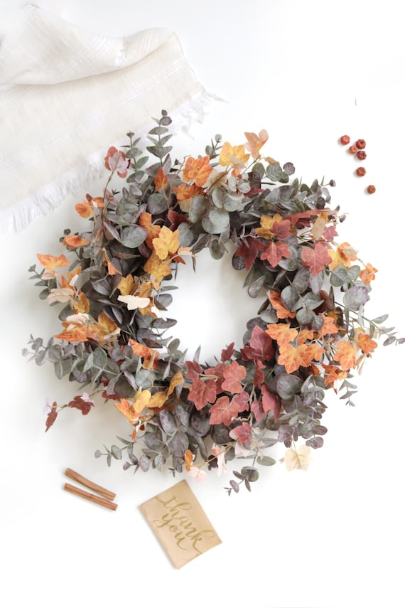 eucalyptus garland with lights on mantel cozy living room fall decor