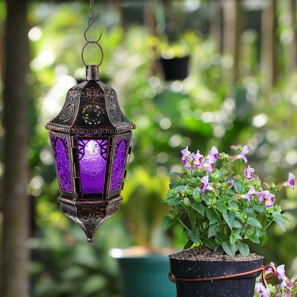 metal lanterns with candles on porch steps