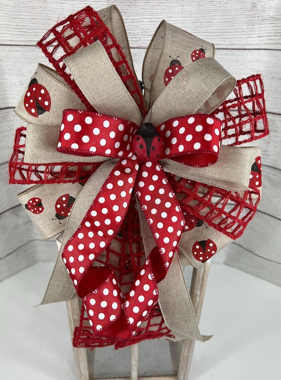 burlap ribbon tied on porch posts