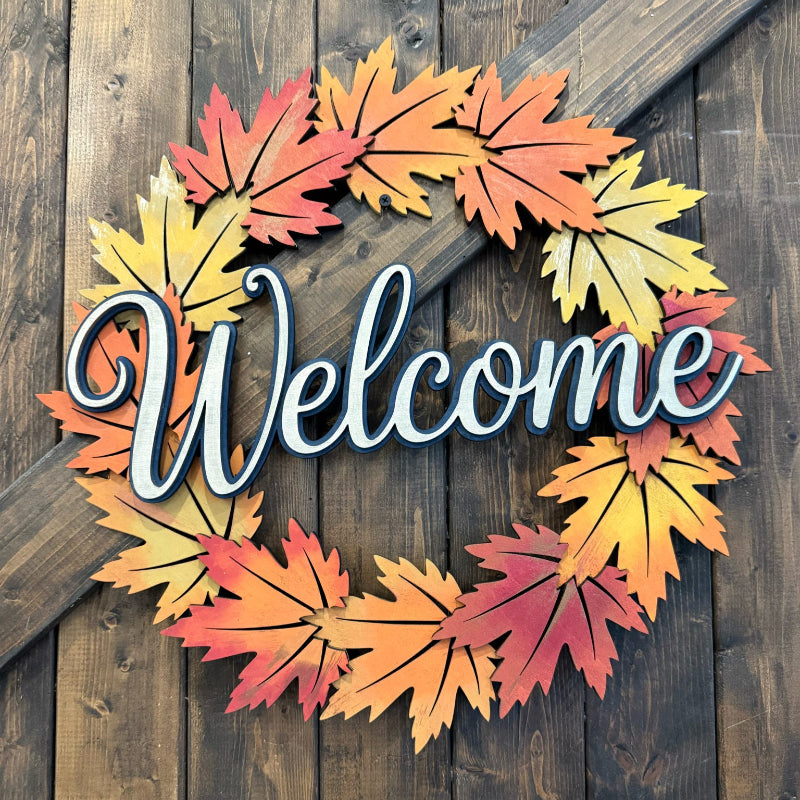 autumn leaf wreath on wooden door