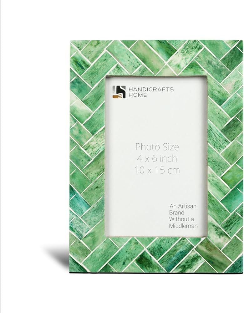 leaf covered picture frame on shelf