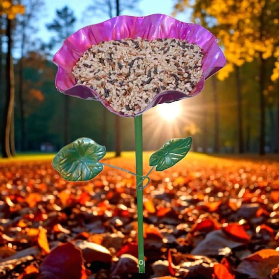 leaf decorated bird feeder in garden