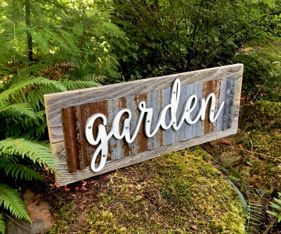 rustic wooden sign in fall garden