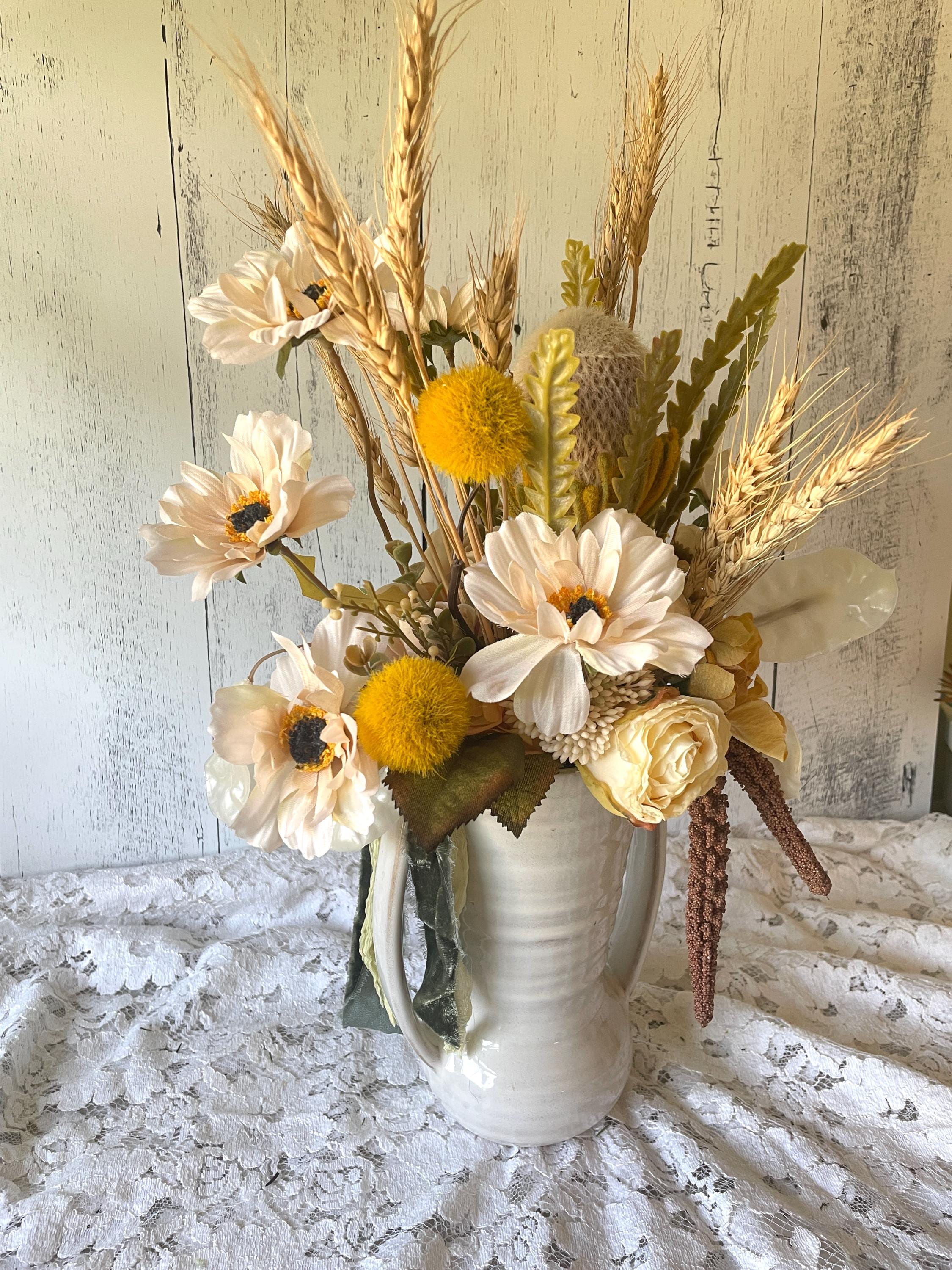 dried wheat bundles in ceramic pitcher centerpiece