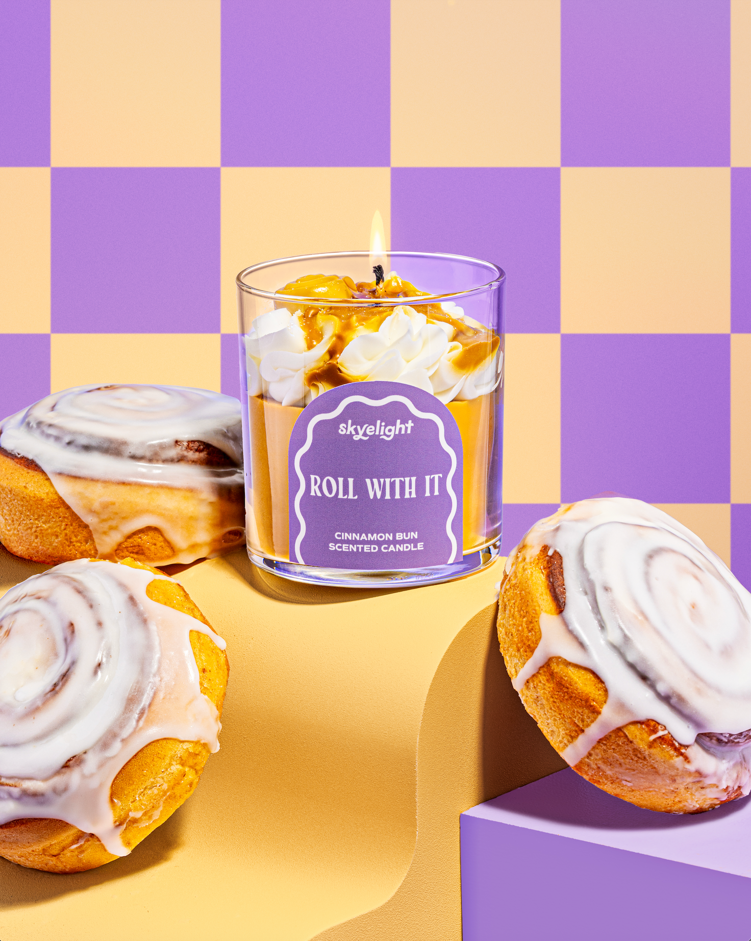 cinnamon roll scented candle with icing drip