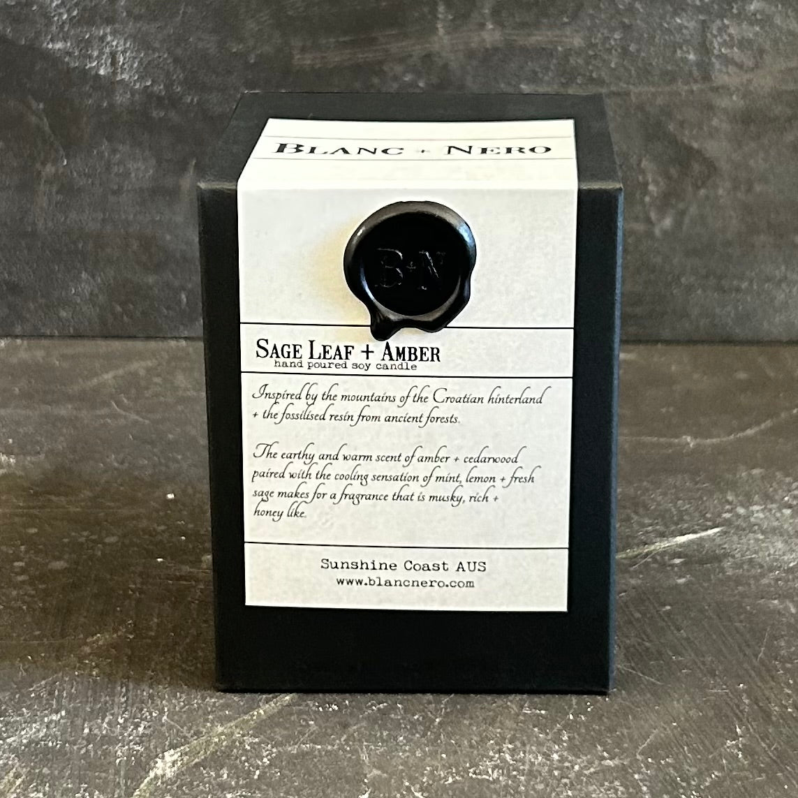 cedarwood sage candle with sage leaf