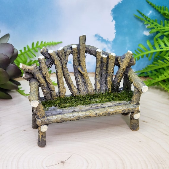 mossy log bench in fairy garden