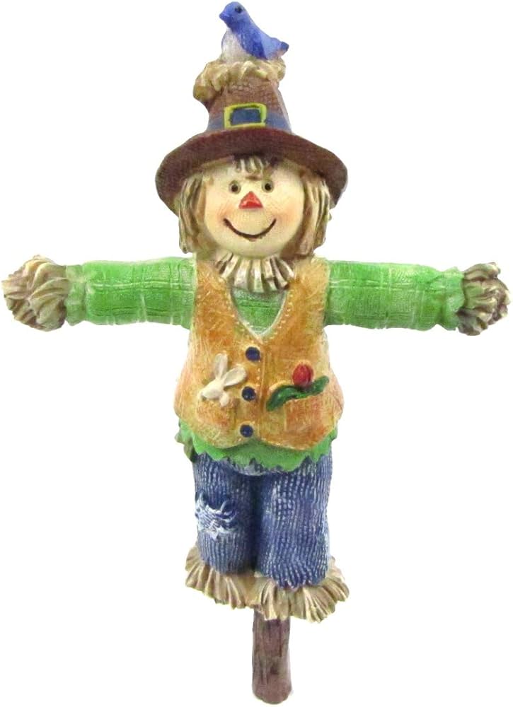 miniature scarecrow in fairy garden