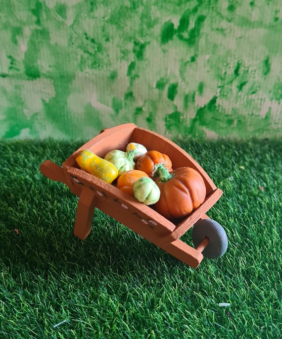 miniature wheelbarrow filled with gourds fairy garden