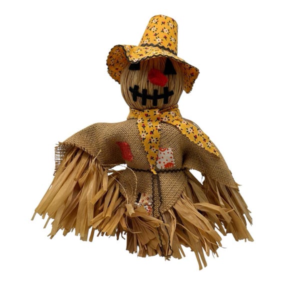 burlap scarecrow on shelf