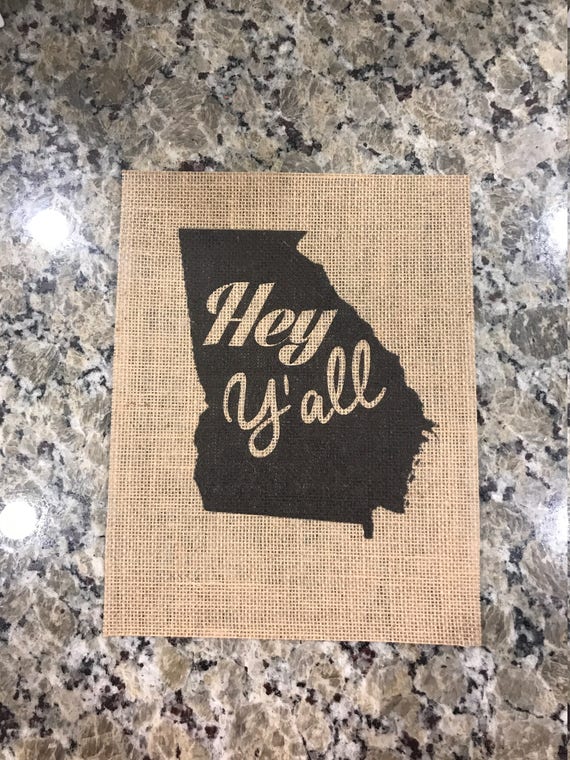 burlap welcome sign on wall
