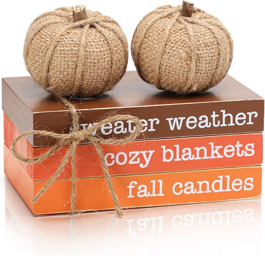 wooden tray with fall pumpkins and candles on kitchen counter