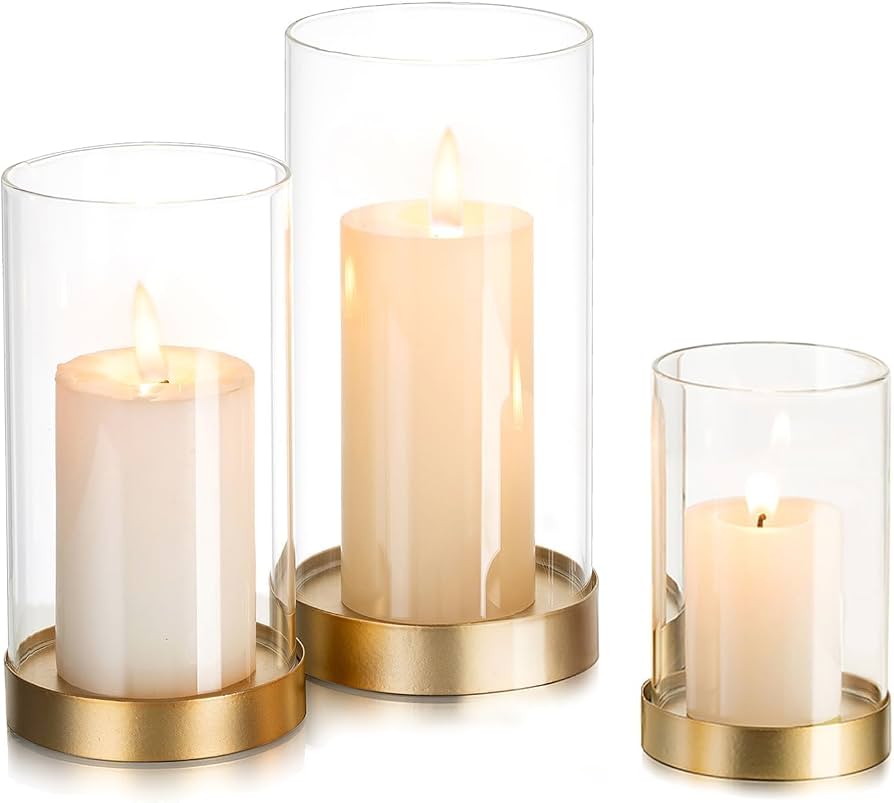 cluster of pillar candles in metal holders on kitchen table