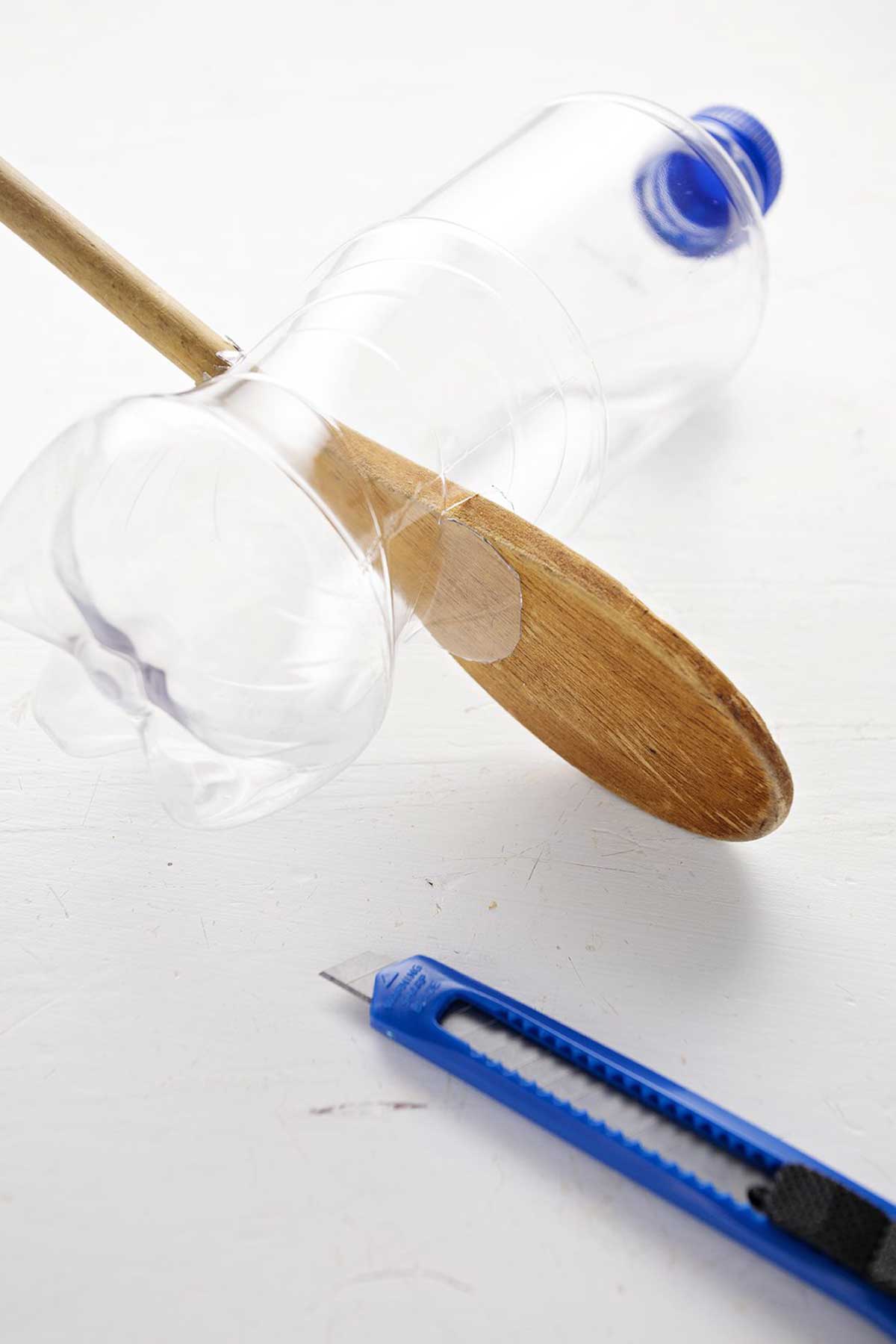 plastic bottle bird feeder with spoon perches