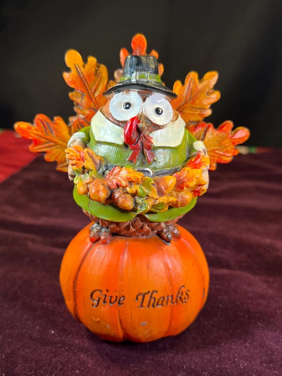painted pumpkin centerpieces on table