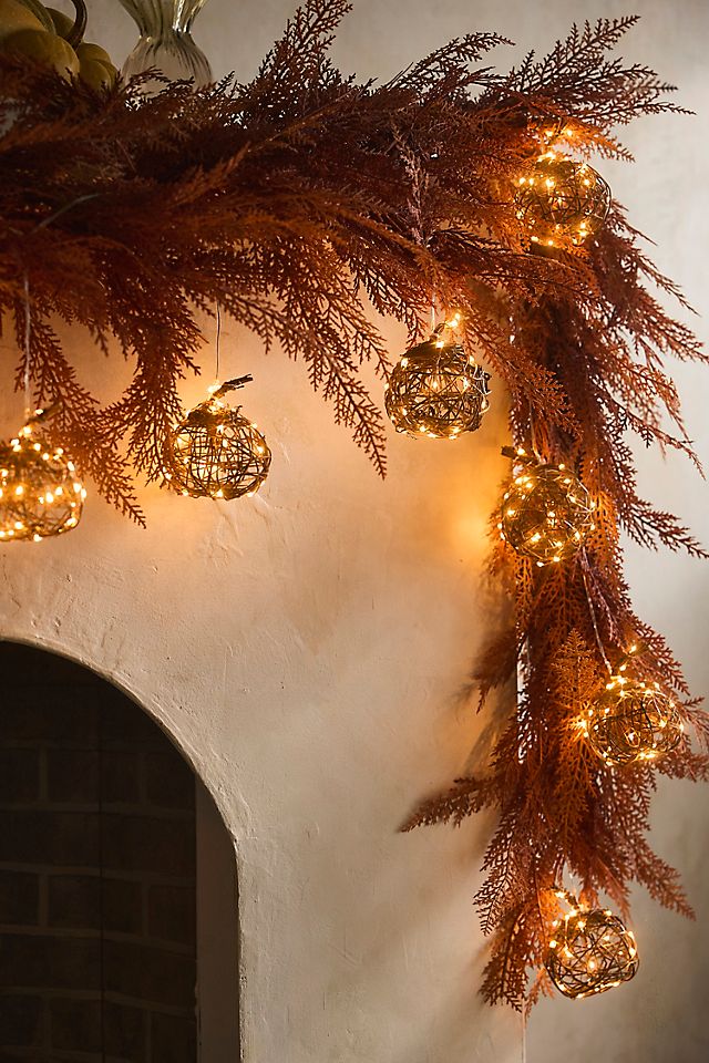 illuminated pumpkins with string lights