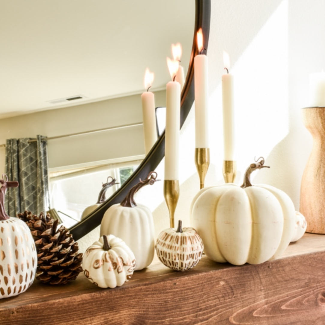 pumpkin mantel arrangement with candles