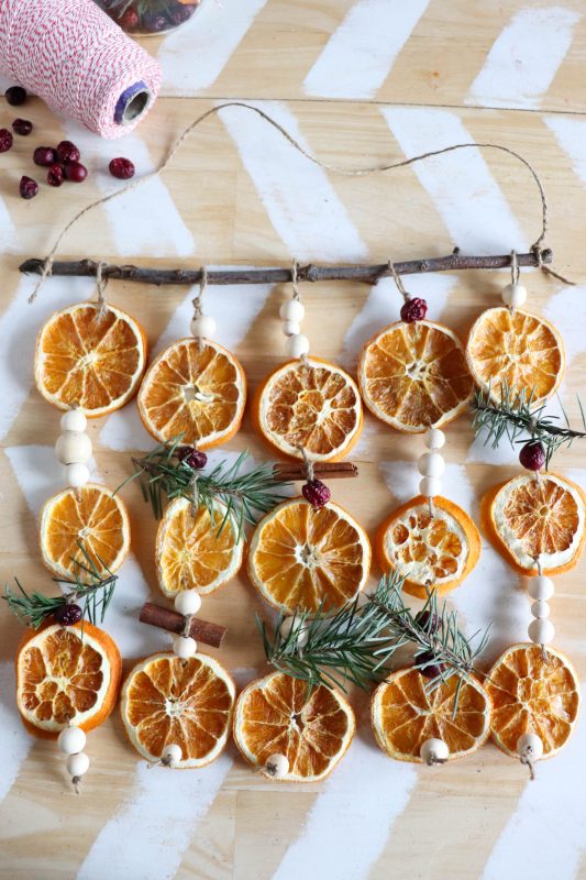 dried orange garland hanging from kitchen island