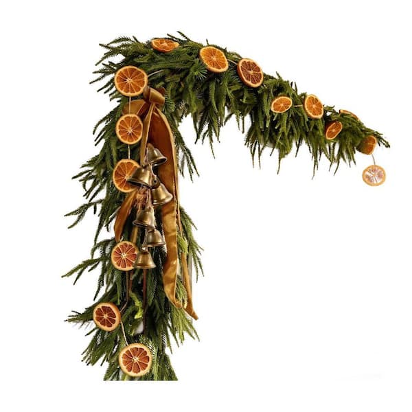 dried orange garland on porch railing
