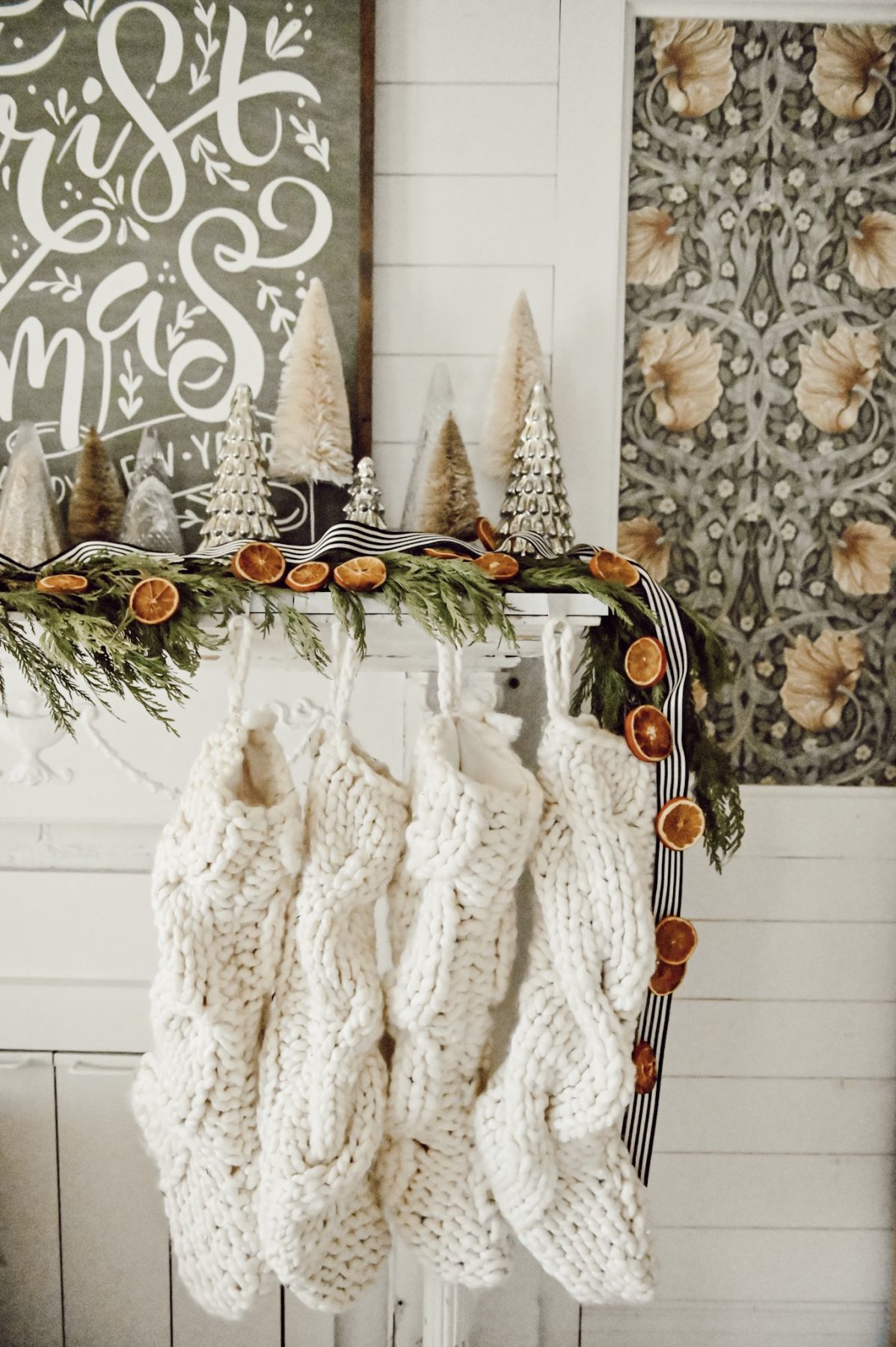 dried orange garland on bed headboard