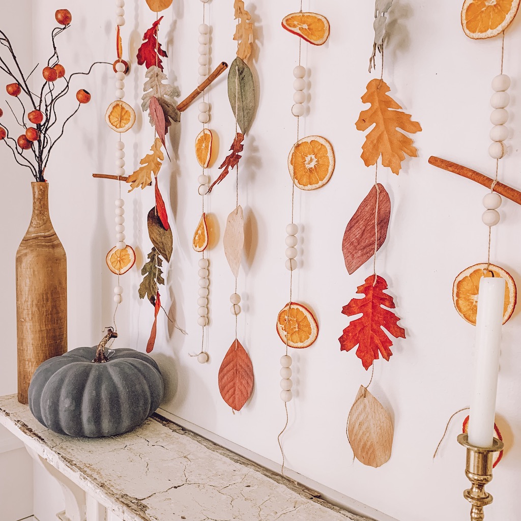 dried orange garland cluster on wall
