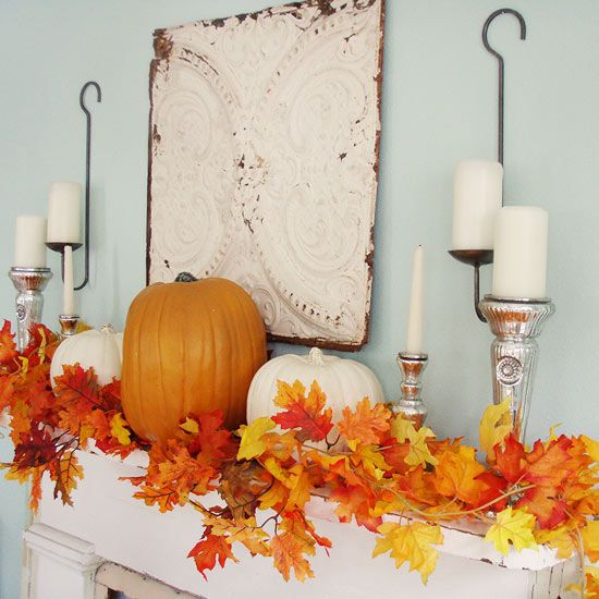 autumn mantel with pumpkins and candles