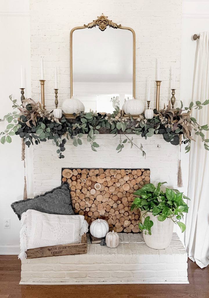 mirror with fall decor on mantel