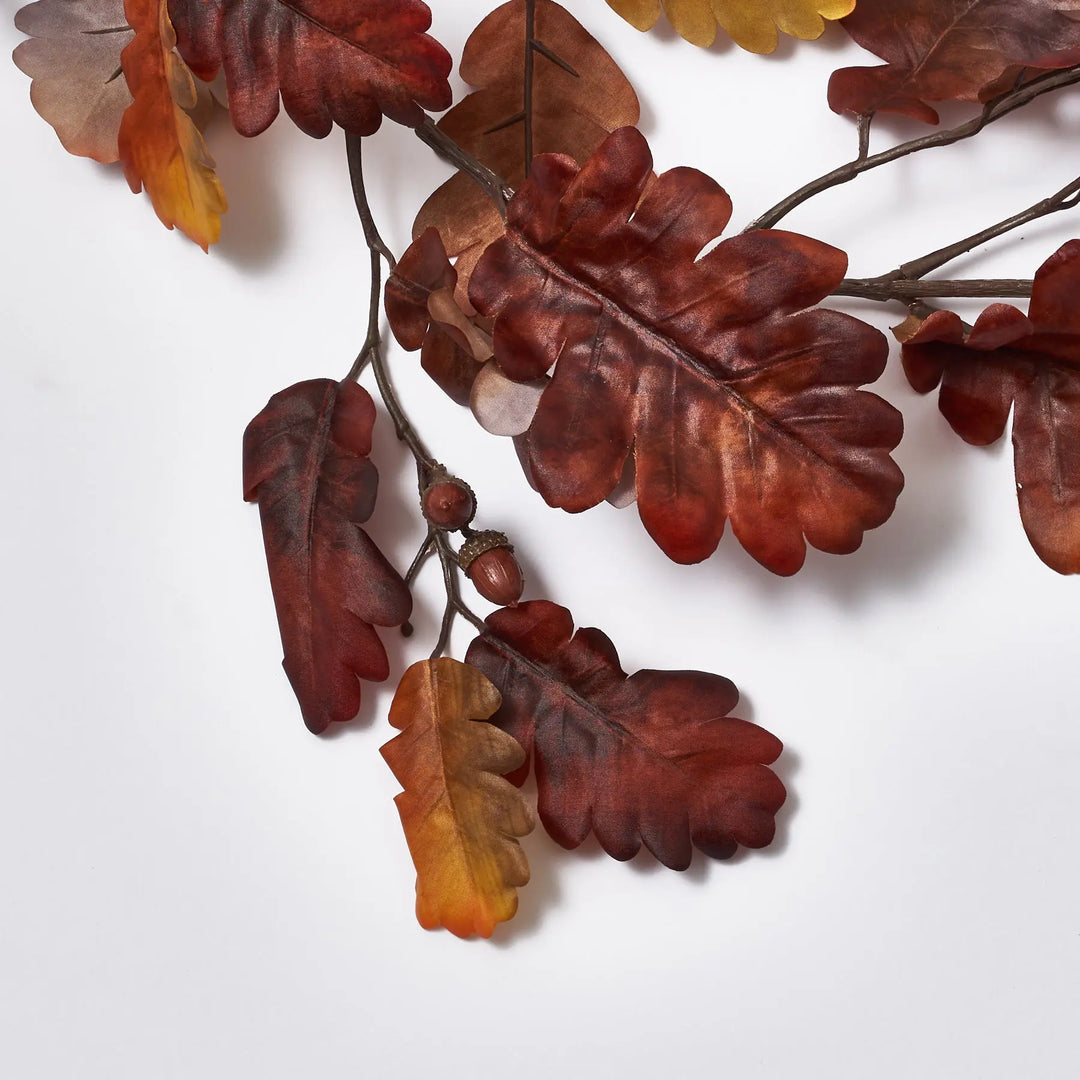rustic branch with autumn leaf garland