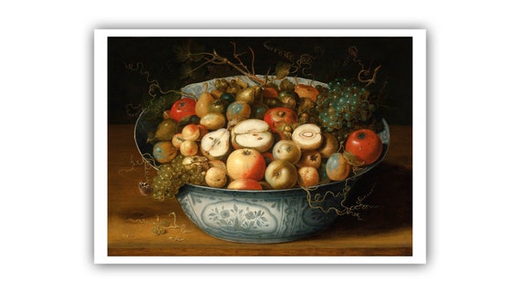 wood bowl with apples nuts and pears on table