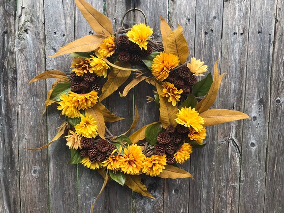 pinecone wreath with dried autumn leaves