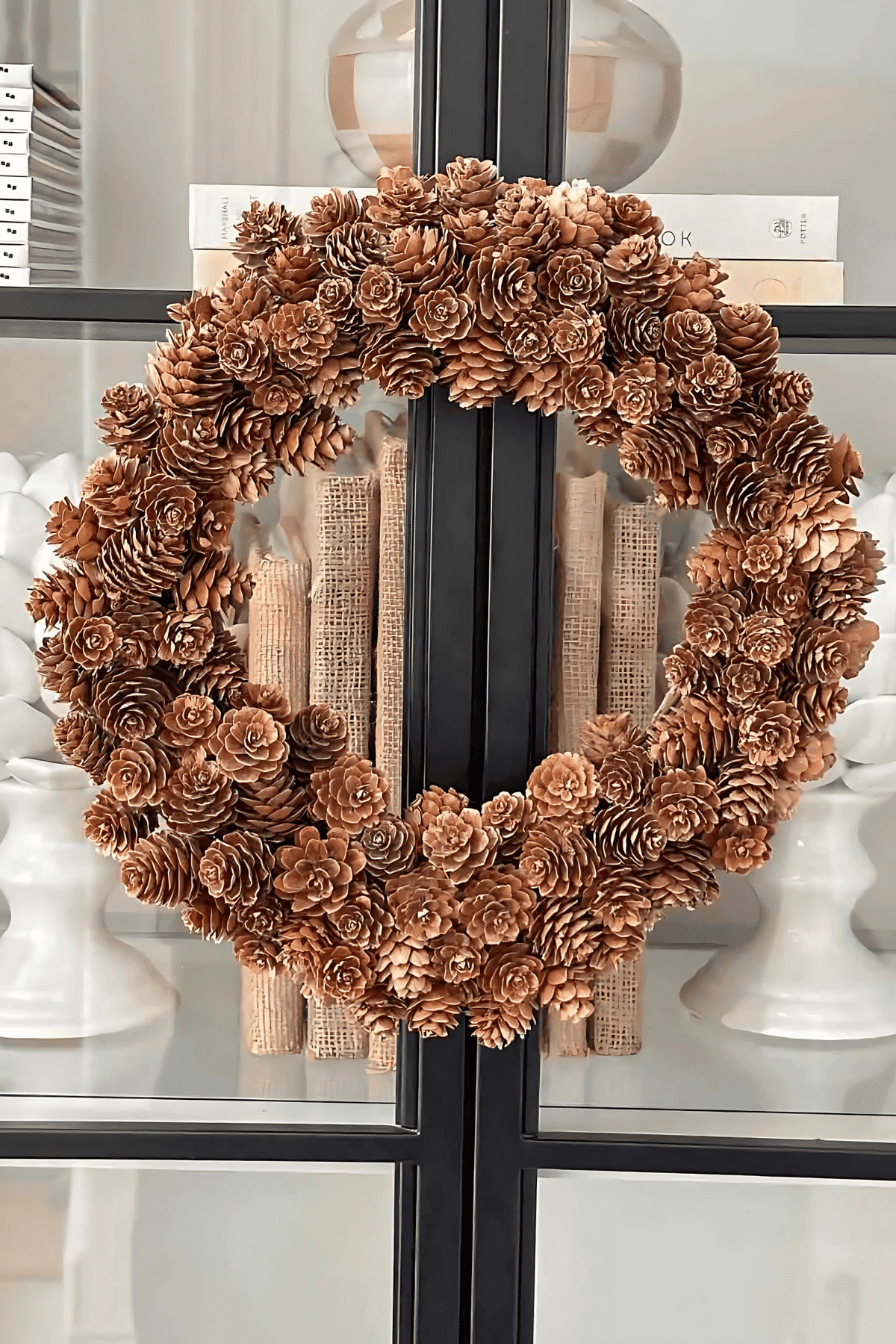 small pinecone wreath on door