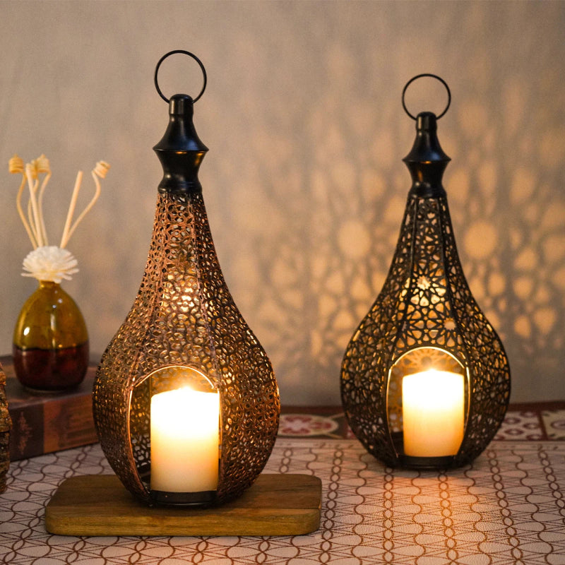 metal lanterns with candles on fall shelf