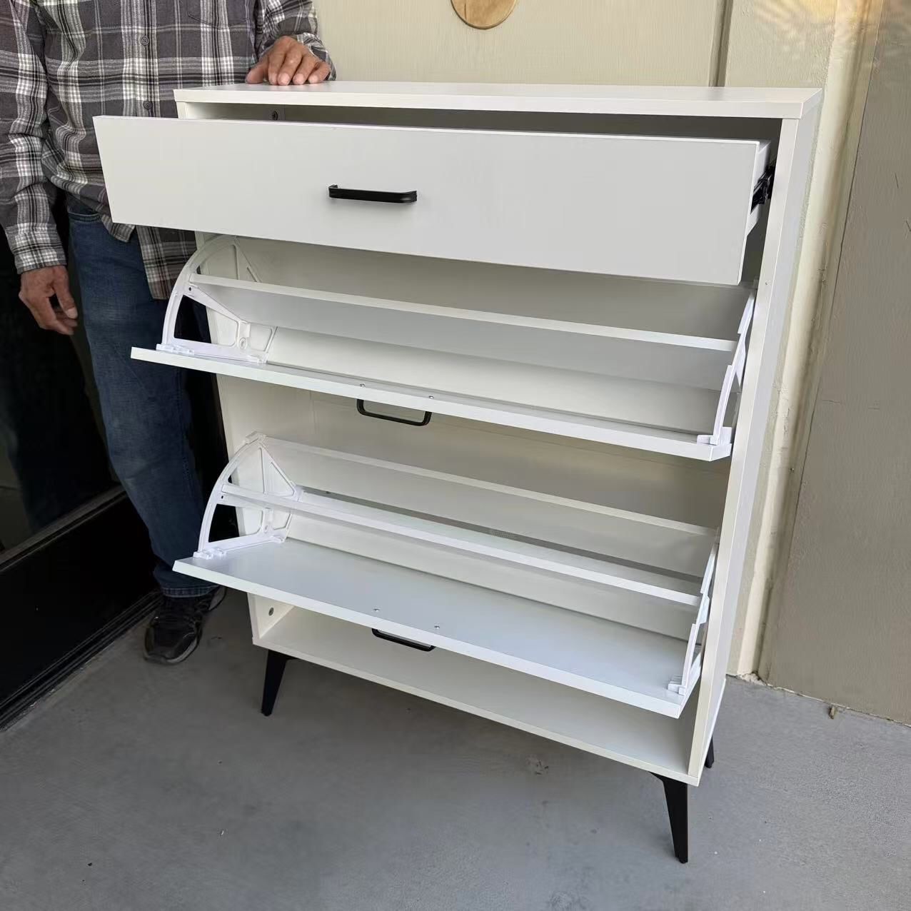 plaid boxes and drawer organizers on shelf