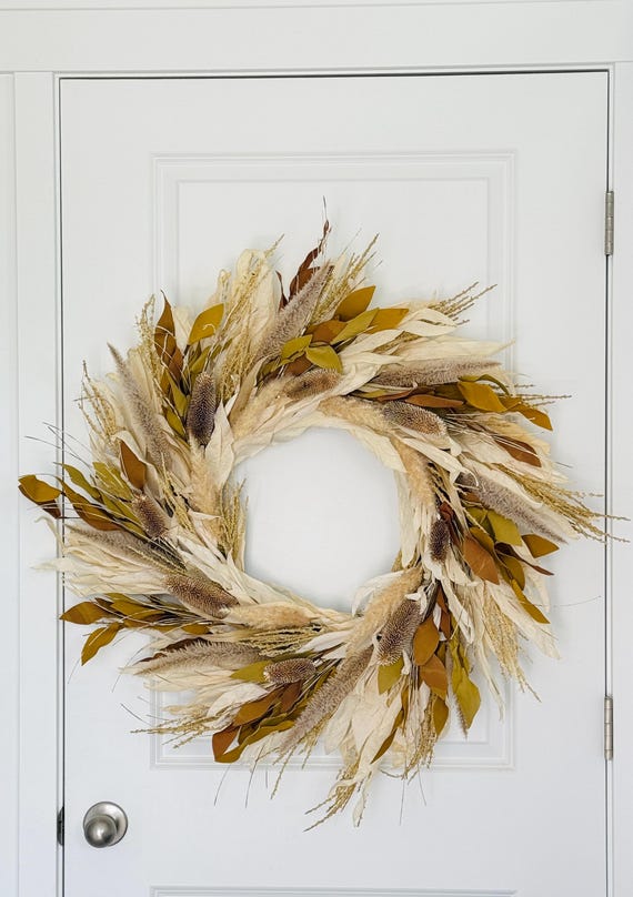 rustic corn husk wreath on wooden door