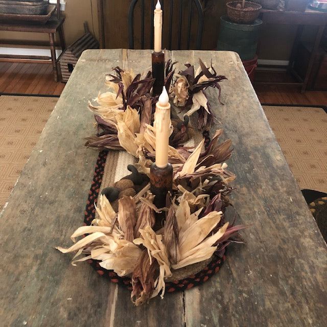 corn husk table centerpiece with candles