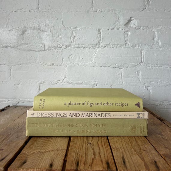stacked books with fall accents on coffee table