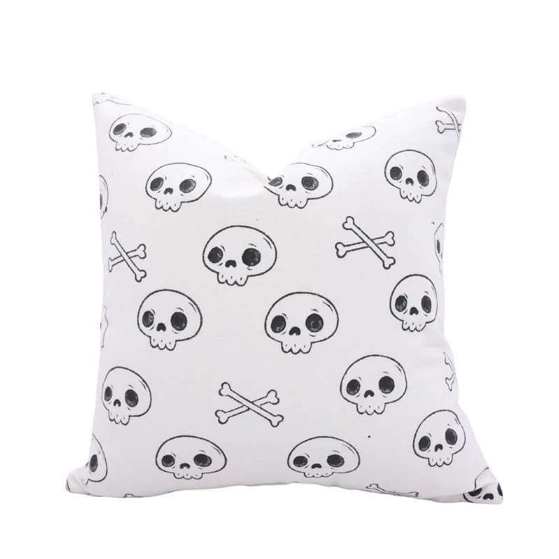 black and white skeleton print pillows on sofa