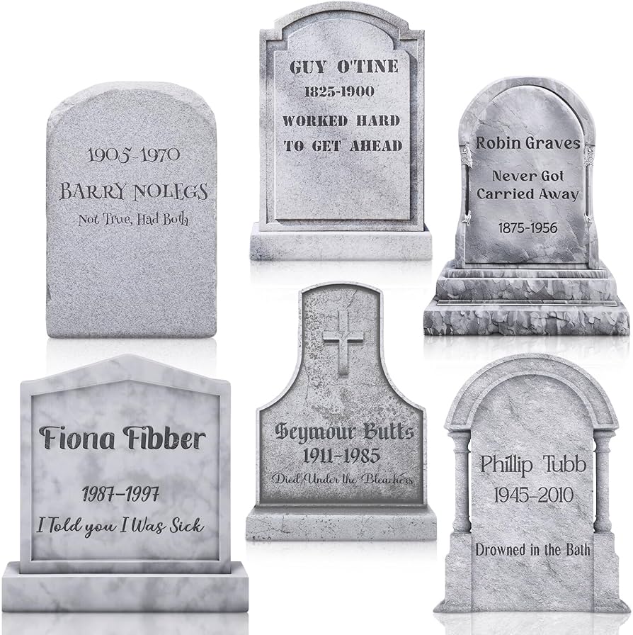 black and white tombstone yard signs in garden