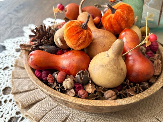 gourd and berry arrangement in low bowl
