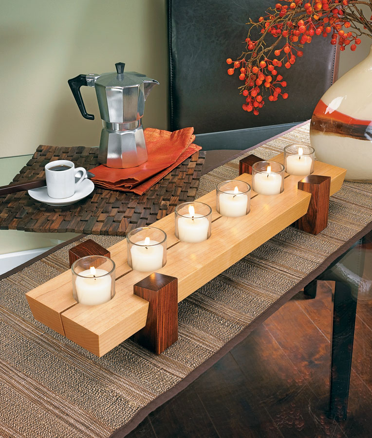 fall candle centerpiece on wooden table
